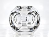 a glass vase that is sitting on a table