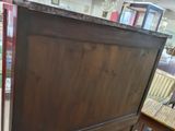 an image of a wooden cabinet in a store