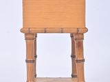 a small wooden table with a drawer on it