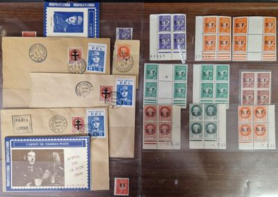 a lot of stamps on the table and a lot of envelopes