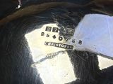 a close up of a metal object with a tag on it