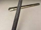 a knife and a nail on a table