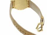 an image of a gold watch with a leather strap on a white background