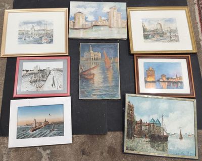 a lot of paintings that are on the floor