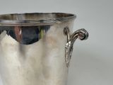 a silver cup that is sitting on a table