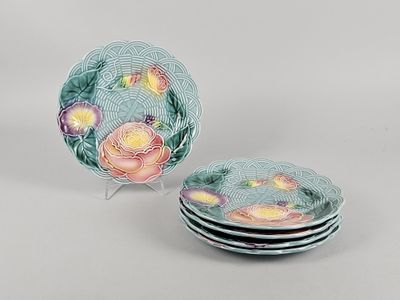 three plates with floral designs are stacked on top of each other