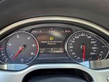 a close up of a car dashboard with a speedometer and gauges