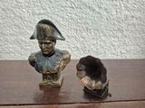 a statue of a man with a hat on a table