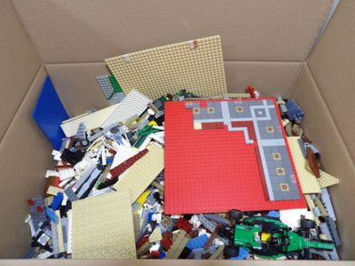 a box full of legos and other toys in it