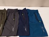 five pairs of men ' s running shorts in various colors