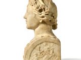 marble bust of a woman with a bird on her head