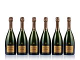 six bottles of champagne lined up in a row