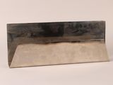 an image of a metal object on a white surface