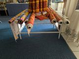 a chair made out of rolls of paper and a chair made out of rolls of paper