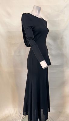a woman ' s black dress on a mannequin mannequin mannequin mannequin mannequin mannequin mannequin mannequin