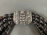 a close up of a bracelet with beads on it