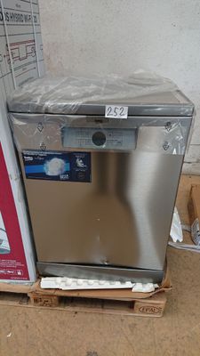 a silver dishwasher sitting on top of a cardboard box