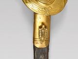 an image of a sword with a cross on the blade