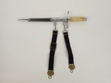 a knife and a pair of scissors hanging on a wall