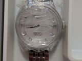a watch that is sitting in a box on the table