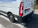 a white van that is parked on the side of the road