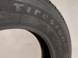 a close up of a tire on a white surface