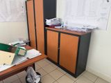 a desk with a bunch of papers on top of it