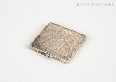 a small square silver object on a white surface