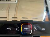 a close up of a toaster on a wooden table