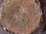 a close up of a piece of metal with writing on it