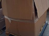 a large cardboard box sitting on a pallet in a warehouse