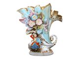 a blue vase with flowers in it on a white background