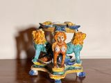 a figurine of a horse and a dog on a table