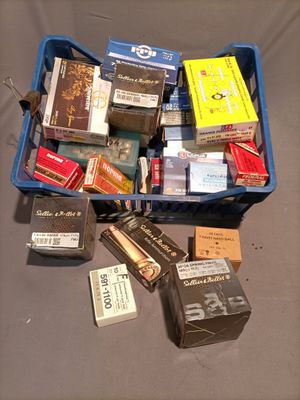 a blue container filled with books and other items