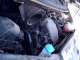 a car engine with a water bottle in it