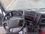 dashboard of a truck with a steering wheel and dashboard controls