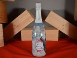 a bottle of wine that is sitting on a table