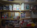 a wooden shelf with many items on it in a room