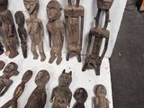 a lot of wooden figurines that are on a table