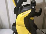 a yellow and black pressurer sitting on top of a white table