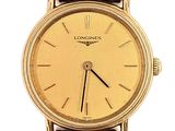 an image of a longines watch with a gold dial and brown leather strap