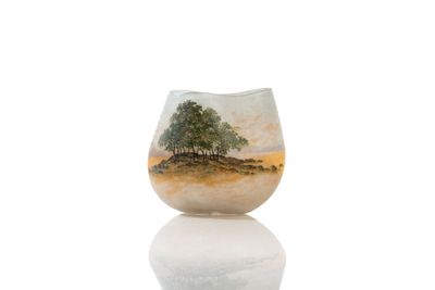 a glass vase with a picture of a tree on it