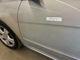 a car with a sticker on the side of it ' s door