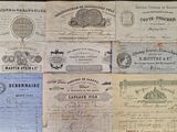 several old paper notes are stacked on top of each other