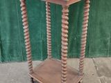 an old wooden table with a chalk board on top of it