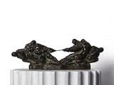 a statue of two people on a boat on a pedestal