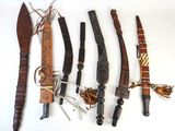 many different types of knives on a table