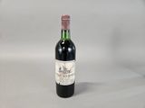 a bottle of wine that is sitting on a table