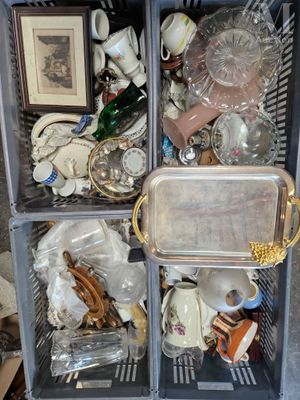 a metal cart with a lot of items inside of it