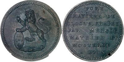 un gros plan d'une pièce de monnaie sur laquelle figure un lion